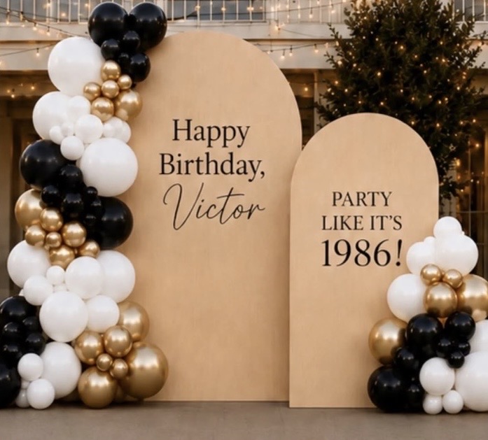 AI mockup — black, white and gold balloon garland on twin arch backdrops